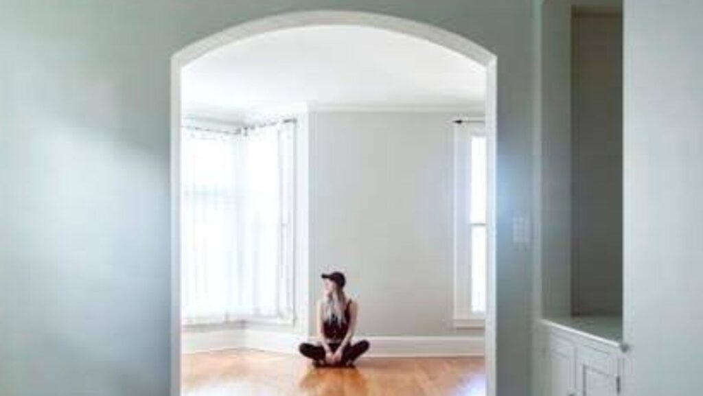 Person sitting in an empty home